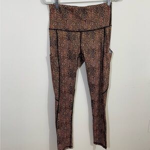 N.W.T. Yomover sz Md compression leggings in a brown animal print